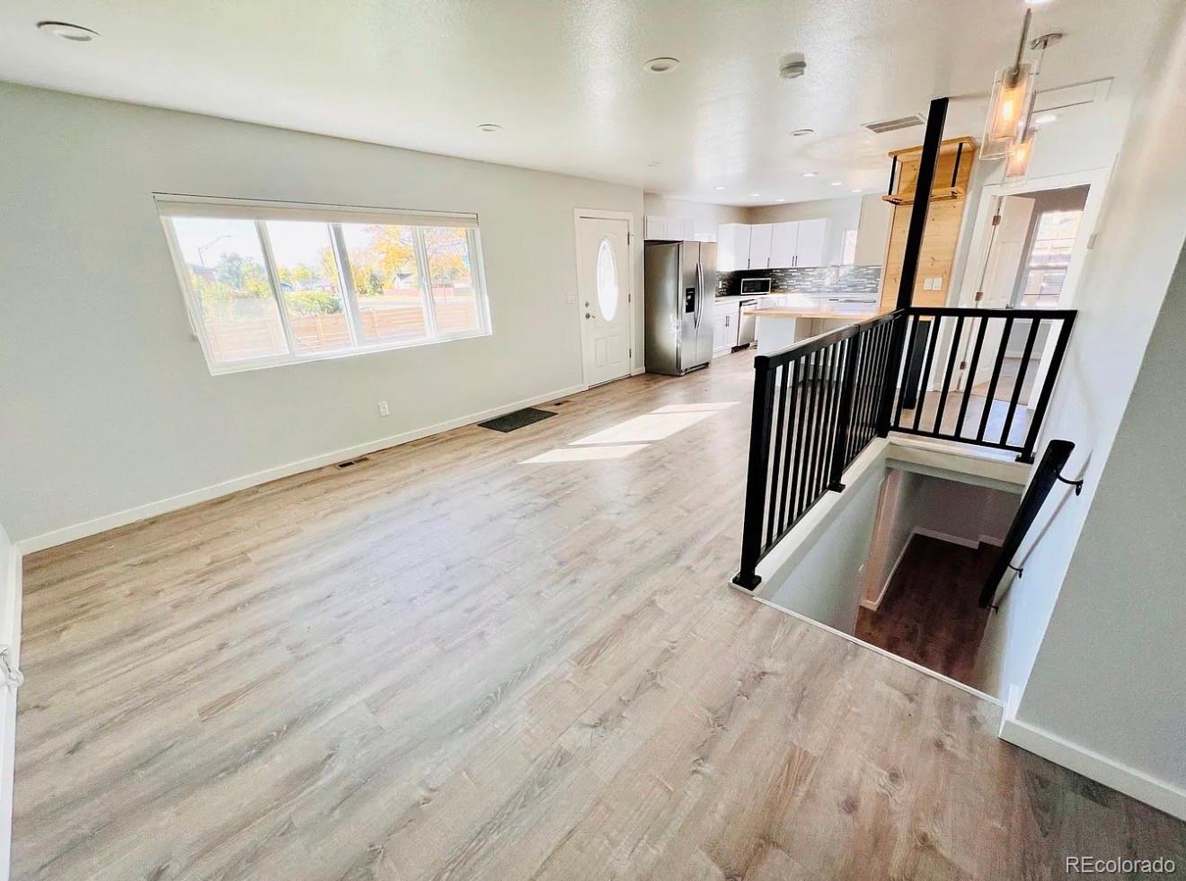 3146 Milwaukee Street Denver, CO 80205 - Photo 9 of 14 an entryway and livingroom with furniture