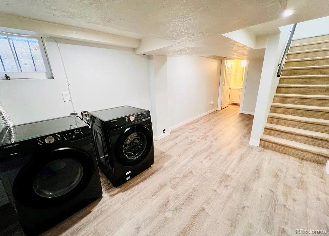 3146 Milwaukee Street Denver, CO 80205 - Photo 10 of 14 a view of a storage & utility room with washer and dryer