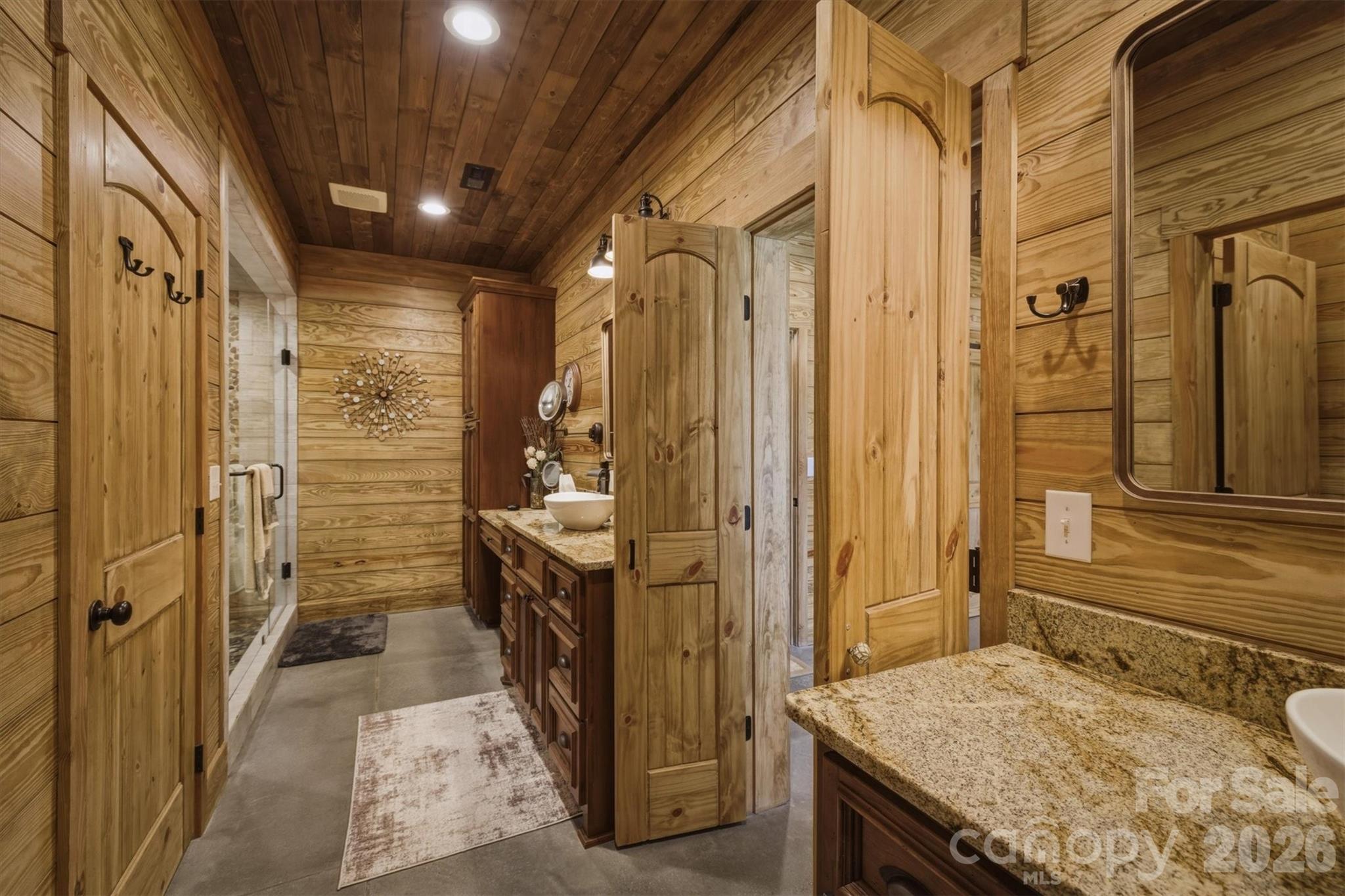 7490 Oak Ridge Church Road Connelly Springs, NC 28612 - Photo 22 of 44 a bathroom with a granite countertop sink and shower
