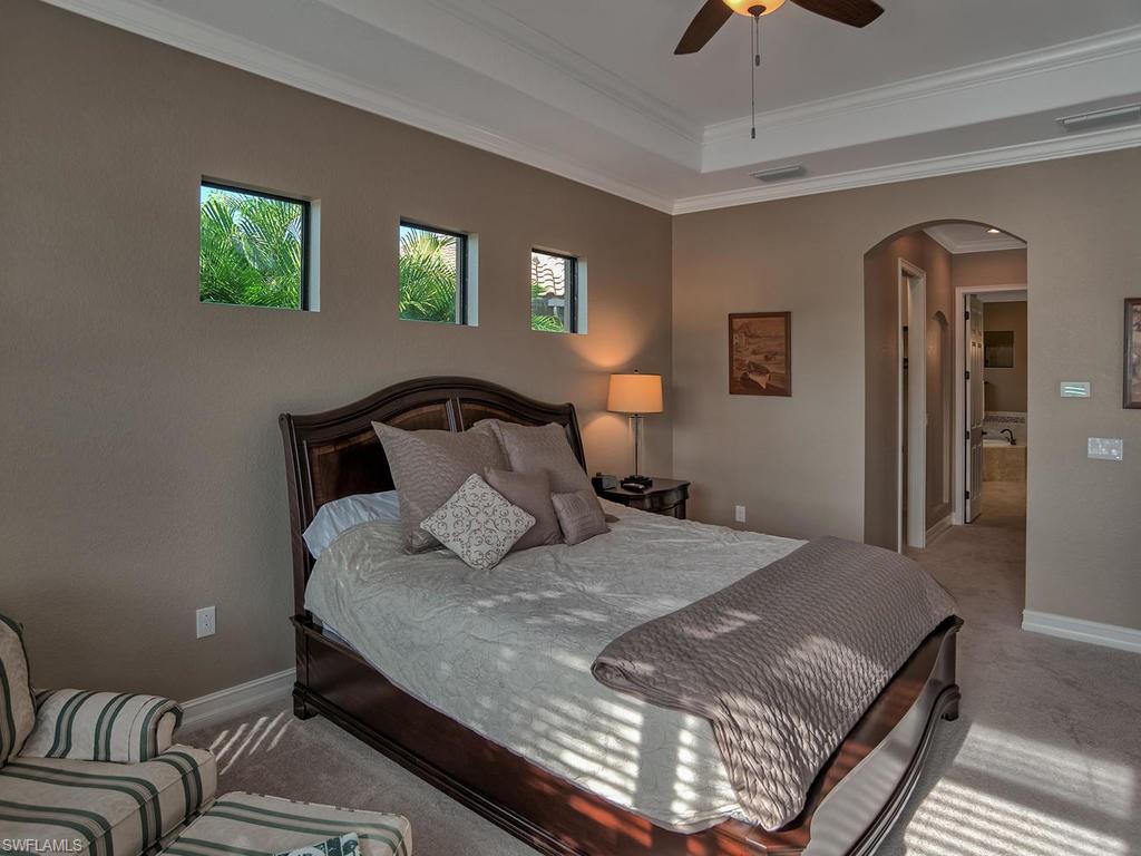 9634 Firenze Circle Naples, FL 34113 - Photo 11 of 35 a bedroom with a bed and window