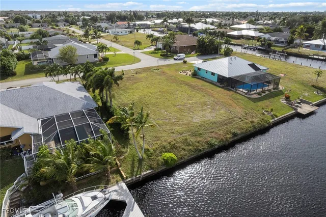 an aerial view of a house with a ocean view