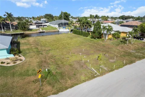a view of residential space with swimming pool and lake view