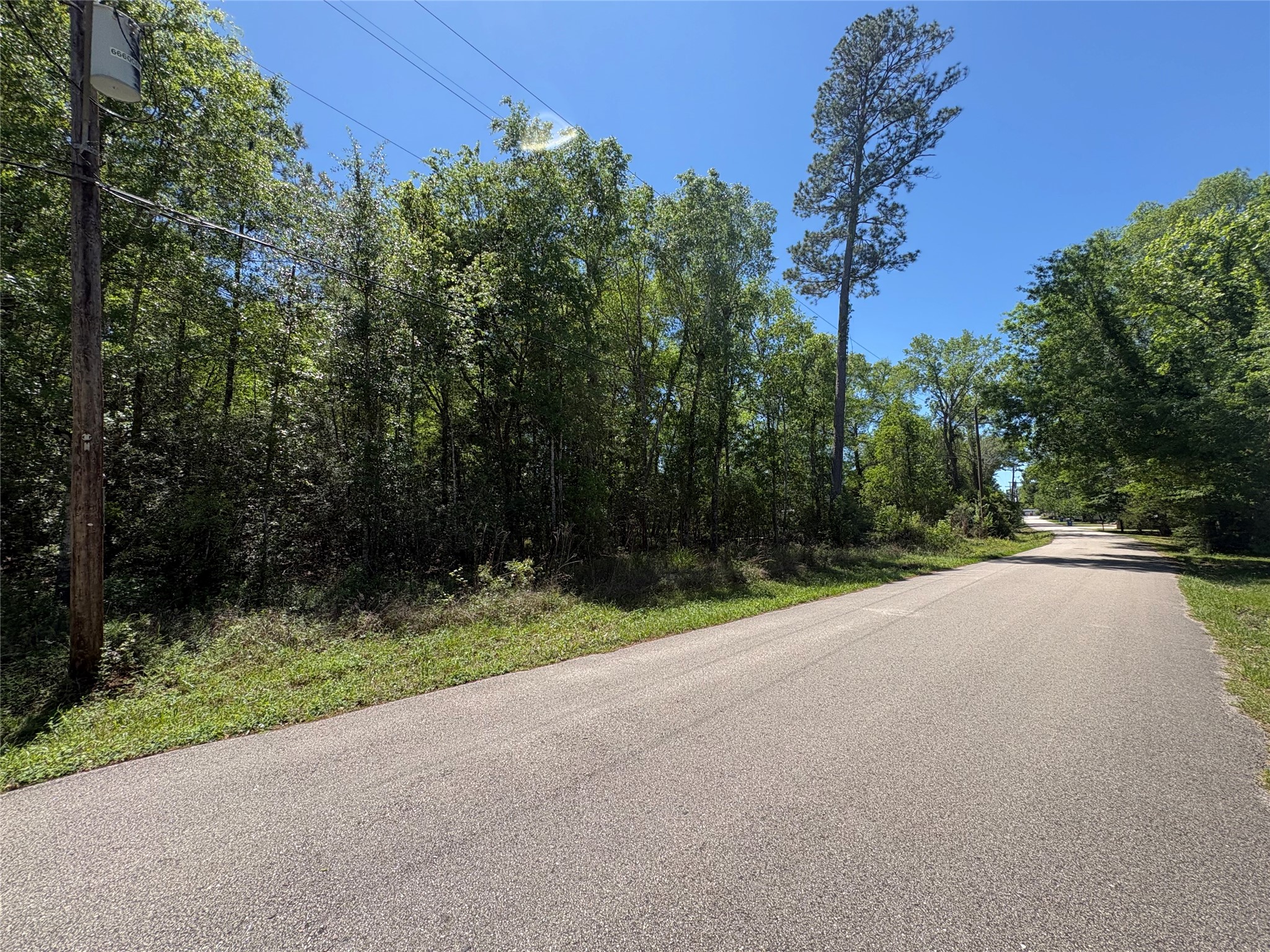 0 East Williford Road Kountze, TX 77625 - Photo 3 of 5 a view of a road with a building in the background