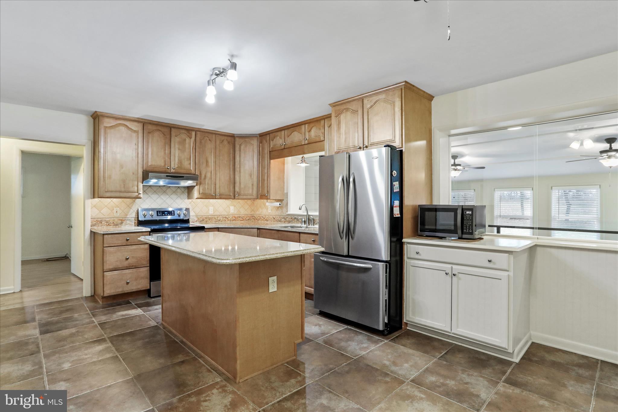 19734 Longmeadow Road Hagerstown, MD 21742 - Photo 11 of 45 a kitchen with stainless steel appliances granite countertop a refrigerator stove a sink and dishwasher