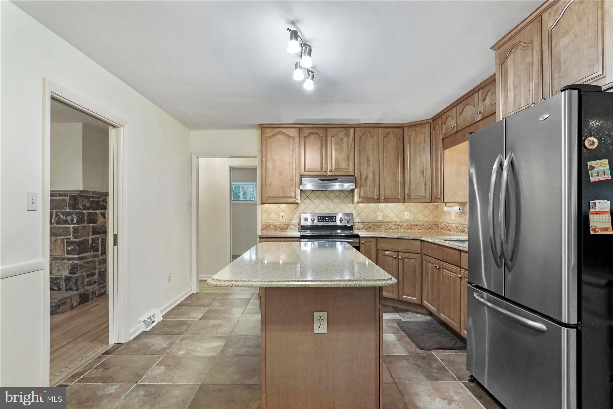 19734 Longmeadow Road Hagerstown, MD 21742 - Photo 13 of 45 a kitchen with stainless steel appliances granite countertop a refrigerator sink and cabinets