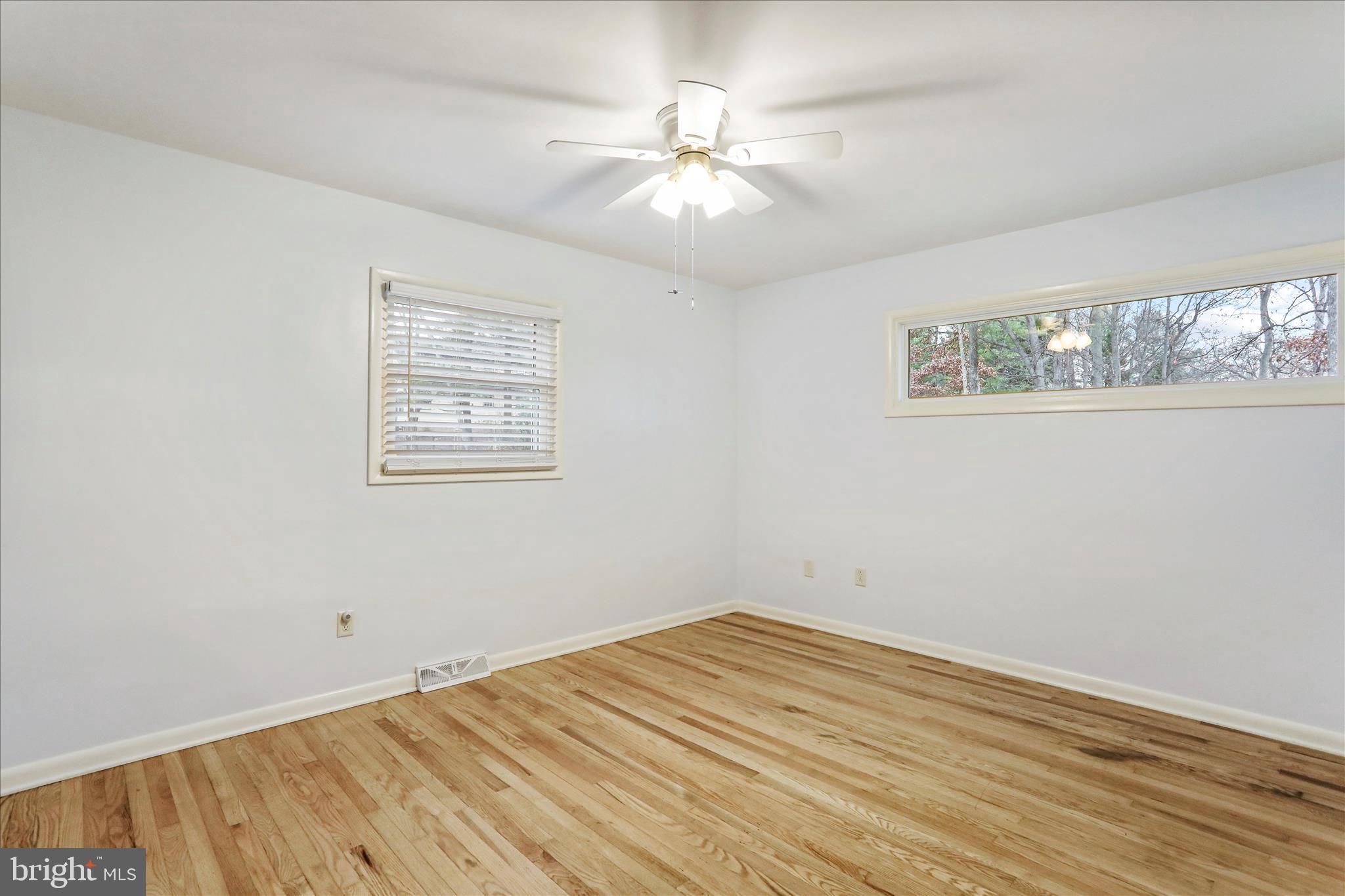 19734 Longmeadow Road Hagerstown, MD 21742 - Photo 22 of 45 a view of a room with wooden floor and window