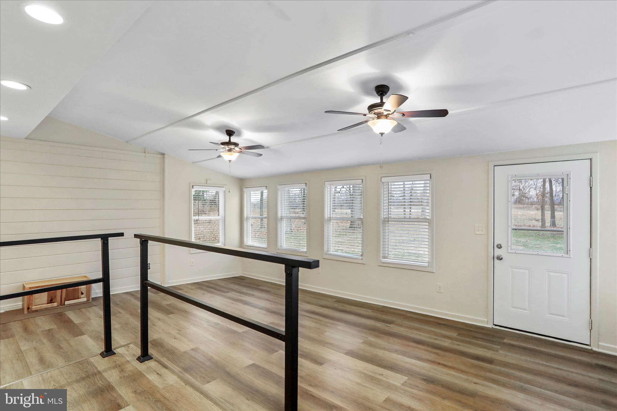 19734 Longmeadow Road Hagerstown, MD 21742 - Photo 25 of 45 a view of an empty room with a window and wooden floor