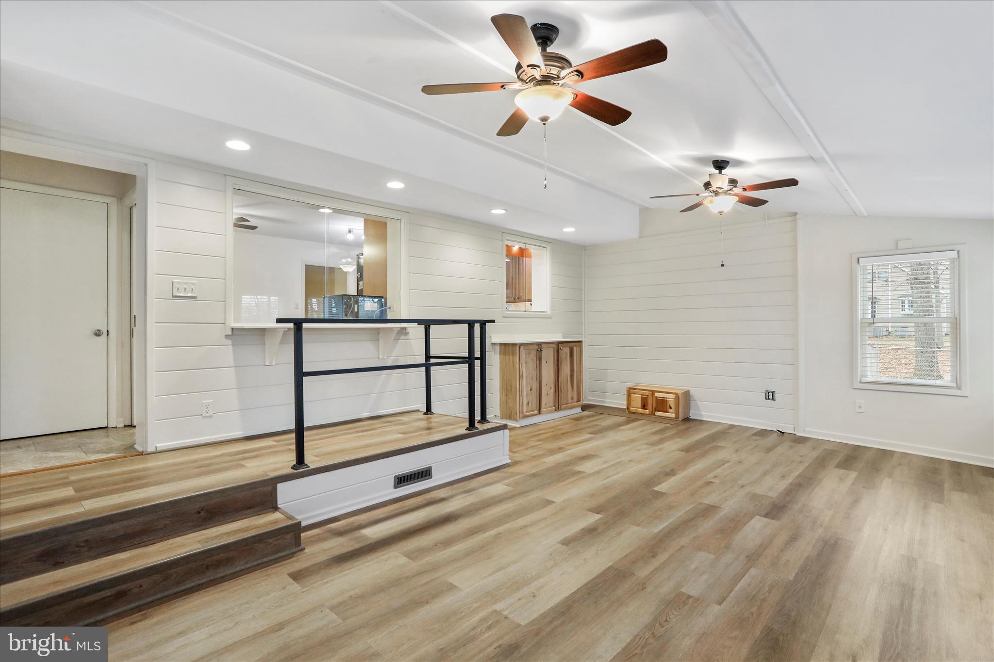 19734 Longmeadow Road Hagerstown, MD 21742 - Photo 26 of 45 a view of a living room a ceiling fan and a rug