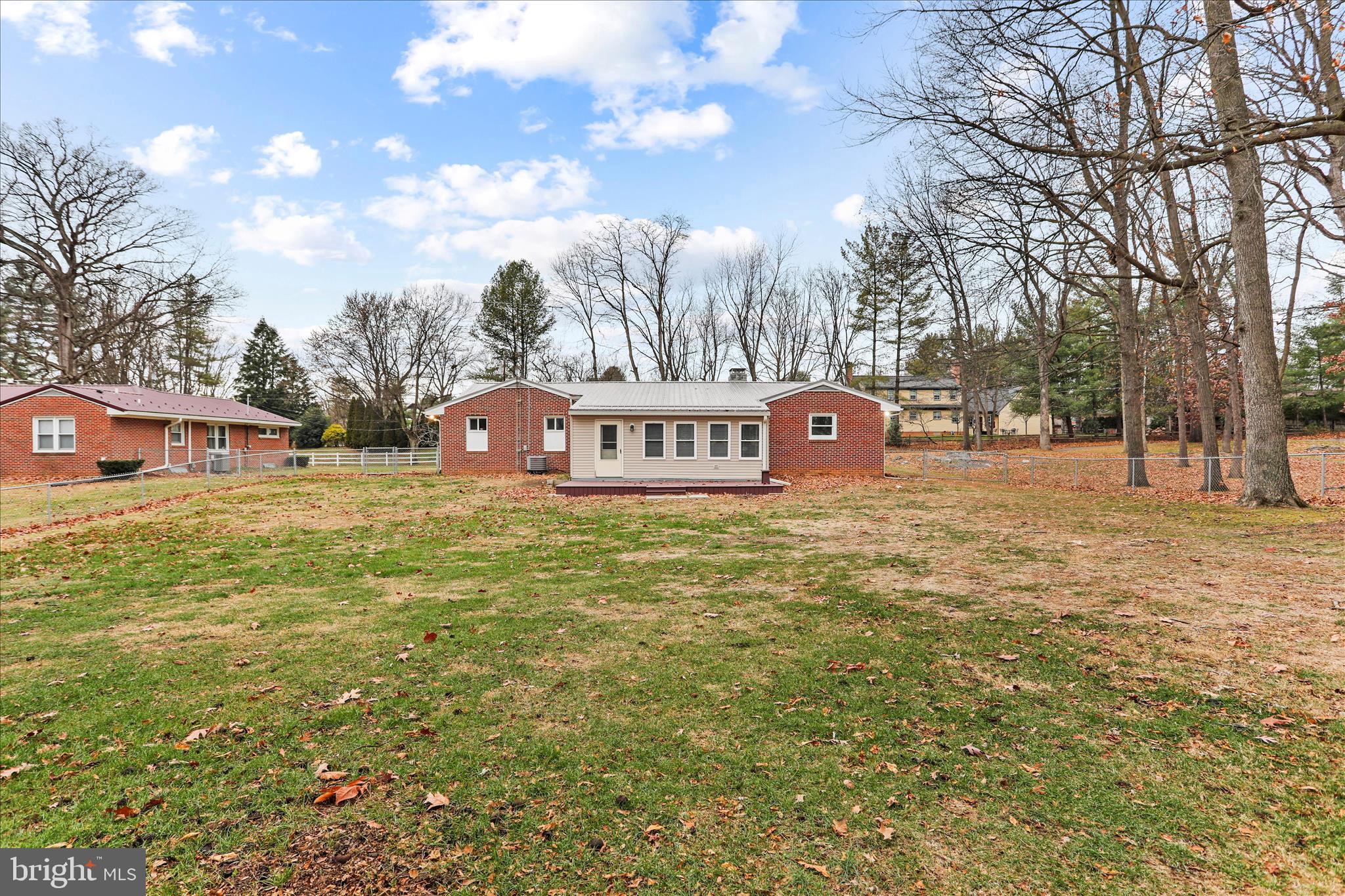 19734 Longmeadow Road Hagerstown, MD 21742 - Photo 43 of 45 a front view of a building with large trees