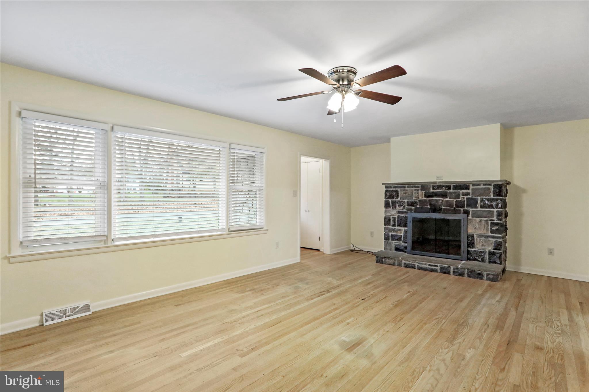 19734 Longmeadow Road Hagerstown, MD 21742 - Photo 7 of 45 a view of an empty room with a window and fireplace