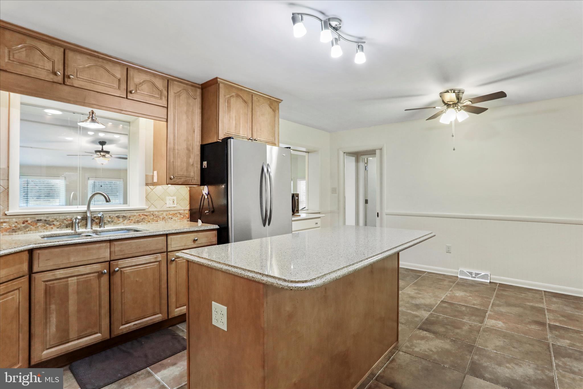 19734 Longmeadow Road Hagerstown, MD 21742 - Photo 9 of 45 a kitchen with stainless steel appliances a refrigerator and a sink
