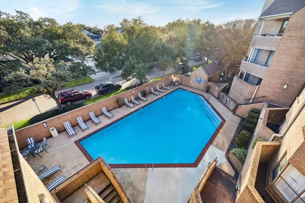 a view of a swimming pool with a patio