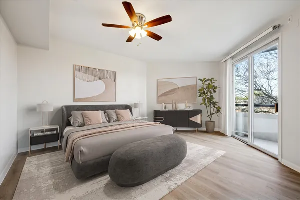 a bedroom with a large bed and a window