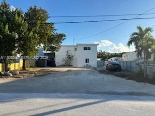 a view of a house with a street