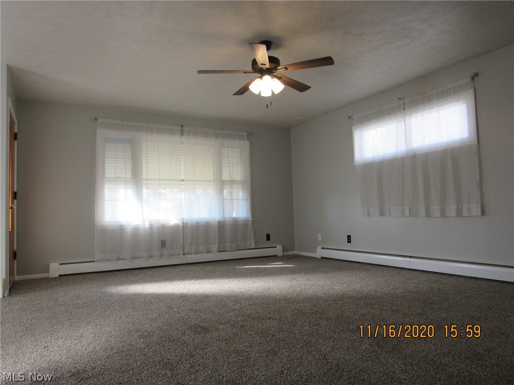 5910 Granger Road Ashtabula, OH 44004 - Photo 6 of 23 Big living room with new carpet, fresh paint and good natural light. Higher windows on North side offer light, air and privacy.