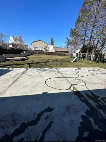 a view of a swimming pool with a yard