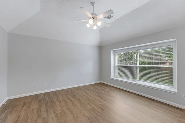 a bathroom with a sink a large mirror and shower