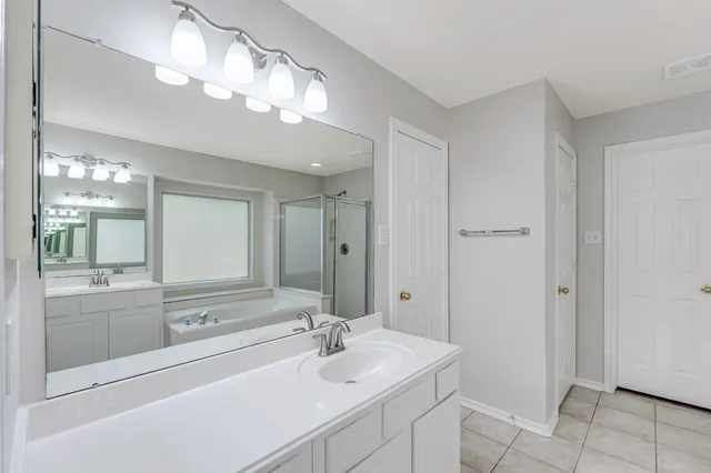 a bathroom with a bathtub and a sink