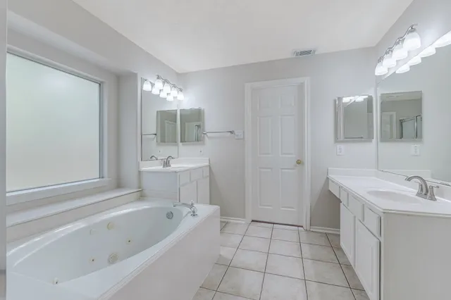 a view of closet with wooden floor