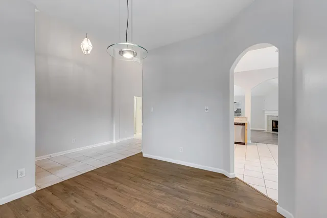 a view of a room with wooden floor and cabinet