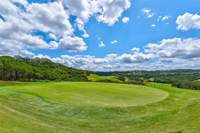 a view of a golf course with a big yard