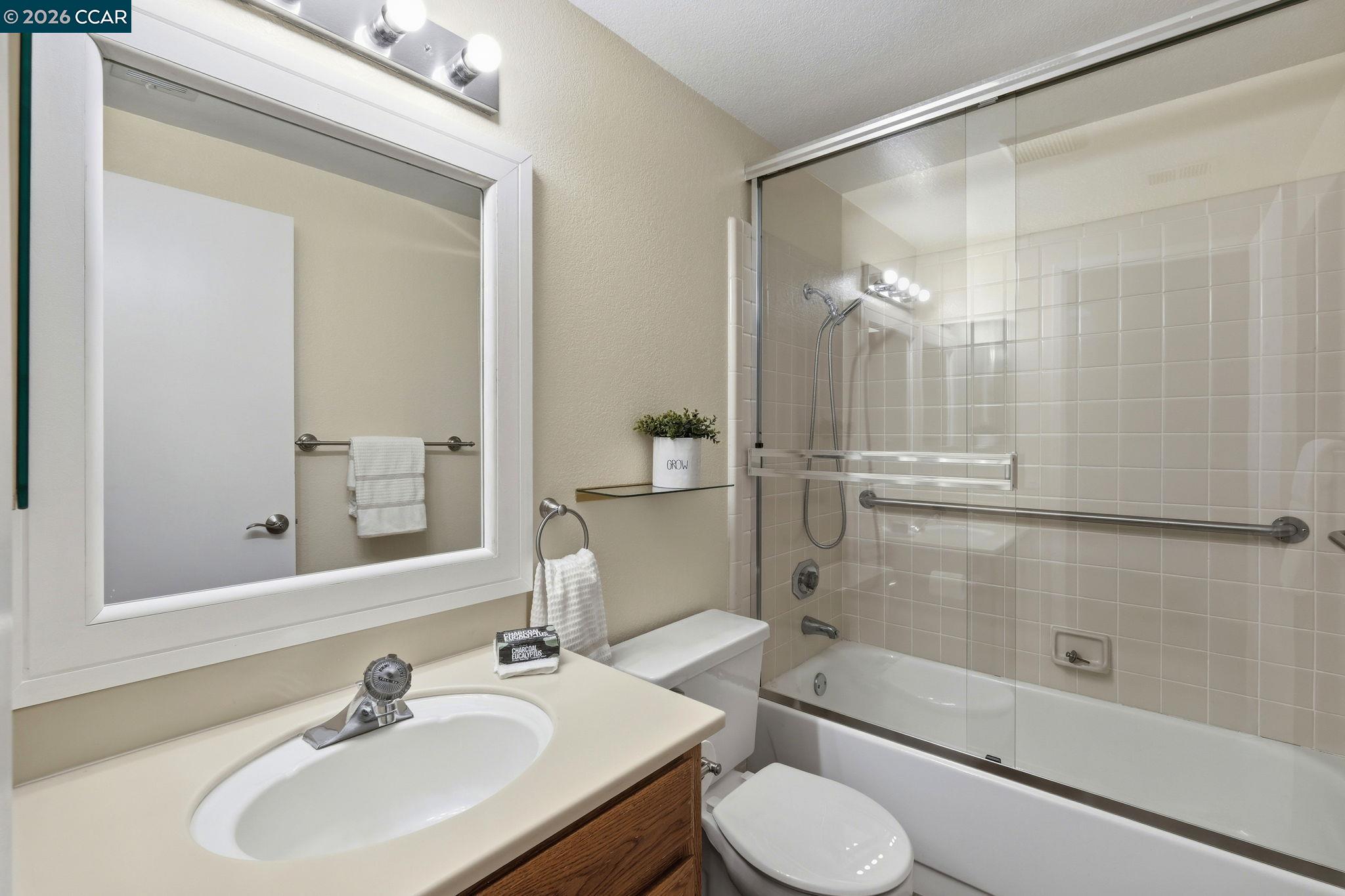 1707 Geary Road Walnut Creek, CA 94597 - Photo 31 of 43 a bathroom with a sink toilet and shower