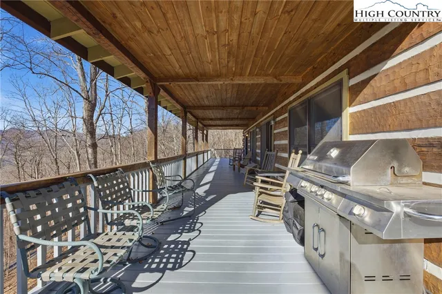 a view of an outdoor space with wooden floor