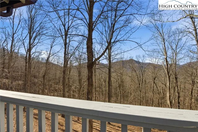 a view of a yard and trees
