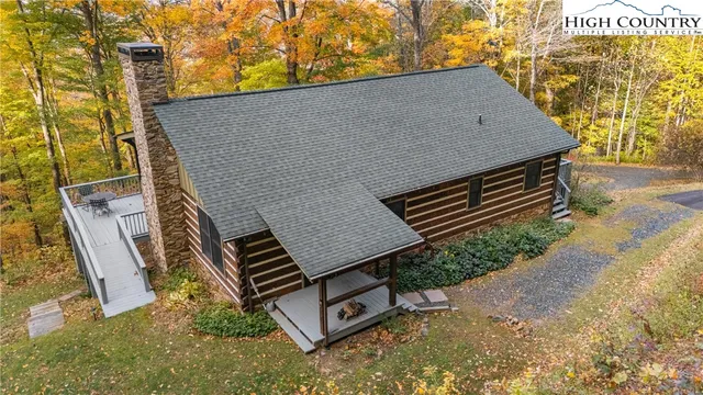 a backyard of a building with wooden fence