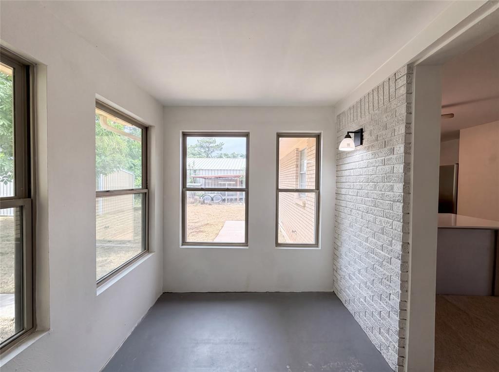 205 West Decatur Street Chico, TX 76431 - Photo 7 of 19 a view of an empty room with a window