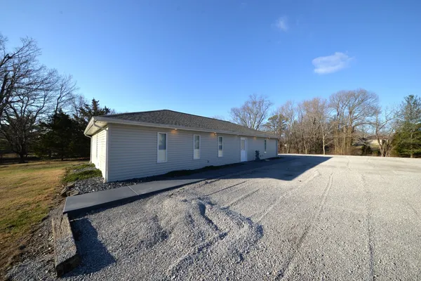 a view of a back yard of the house