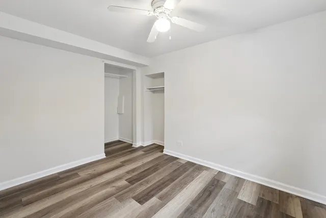 a view of room with window and ceiling fan