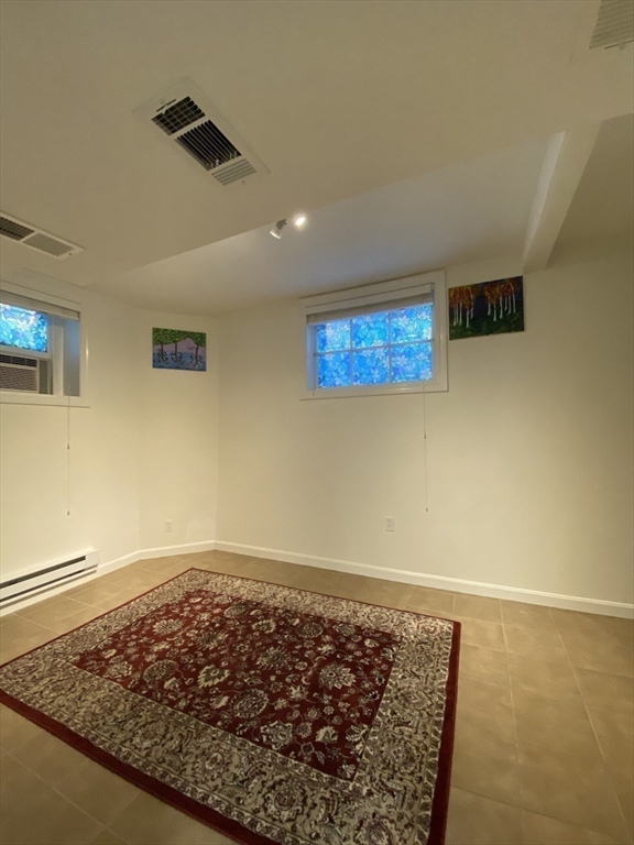 1 Dana Street, Unit 2 Cambridge, MA 02138 - Photo 8 of 11 a view of hallway with rug and ceiling fan