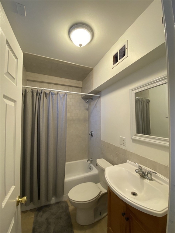 1 Dana Street, Unit 2 Cambridge, MA 02138 - Photo 10 of 11 a bathroom with a sink toilet and shower