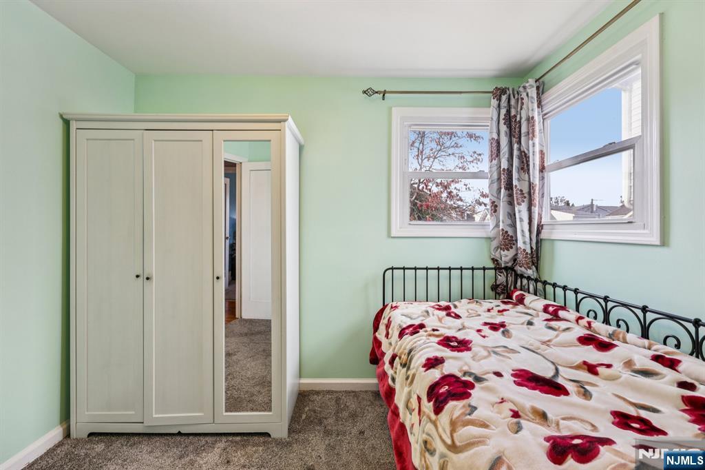 18 Scher Place Passaic, NJ 07055 - Photo 13 of 22 a bedroom with a bed and a window