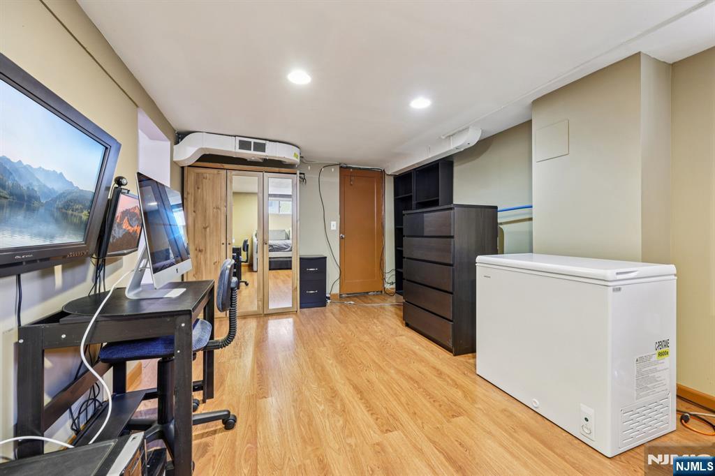 18 Scher Place Passaic, NJ 07055 - Photo 21 of 22 a kitchen with refrigerator and cabinets