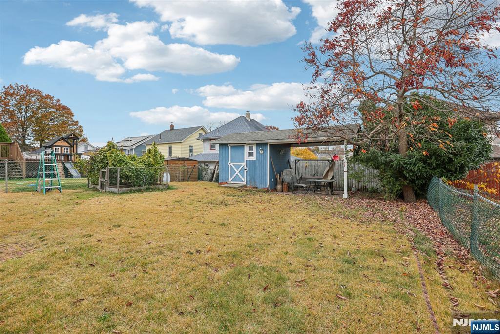 18 Scher Place Passaic, NJ 07055 - Photo 22 of 22 a front view of a house with a garden