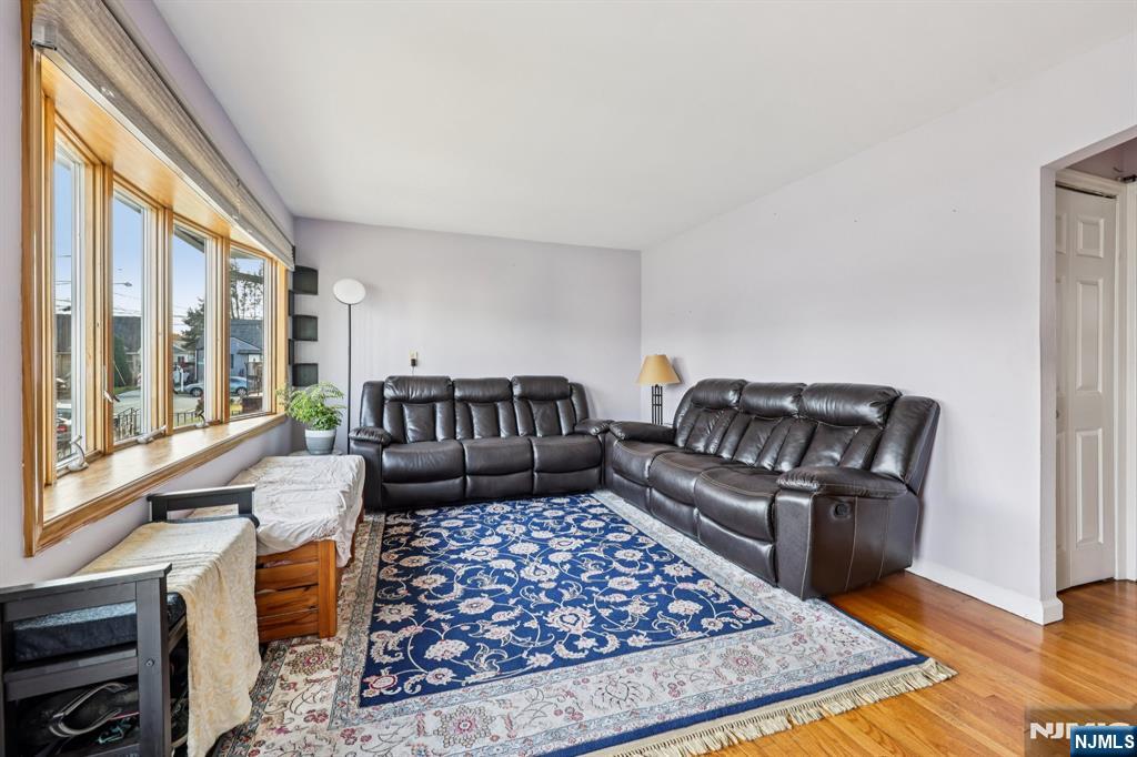 18 Scher Place Passaic, NJ 07055 - Photo 4 of 22 a living room with furniture and a rug