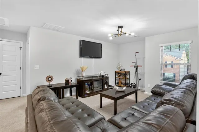 a bedroom with bed and a table