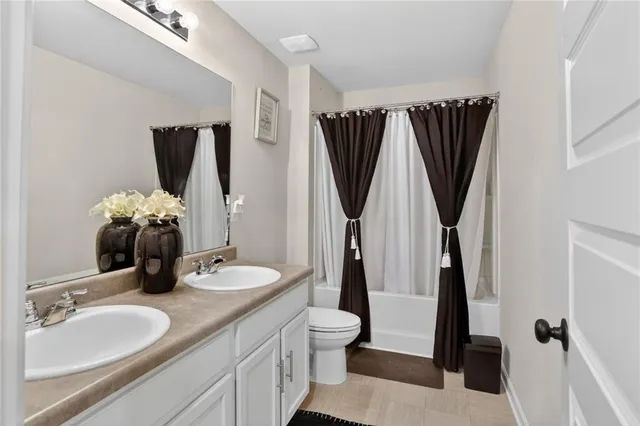 a bathroom with a sink vanity and a mirror