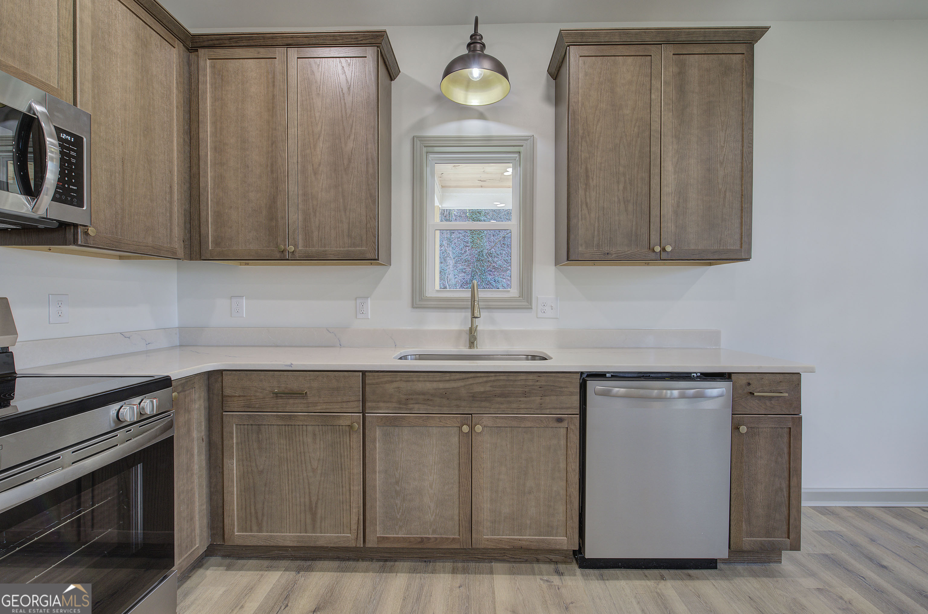 117 East Boundary Street Southeast Rome, GA 30161 - Photo 12 of 36 a kitchen with cabinets a sink and a stove