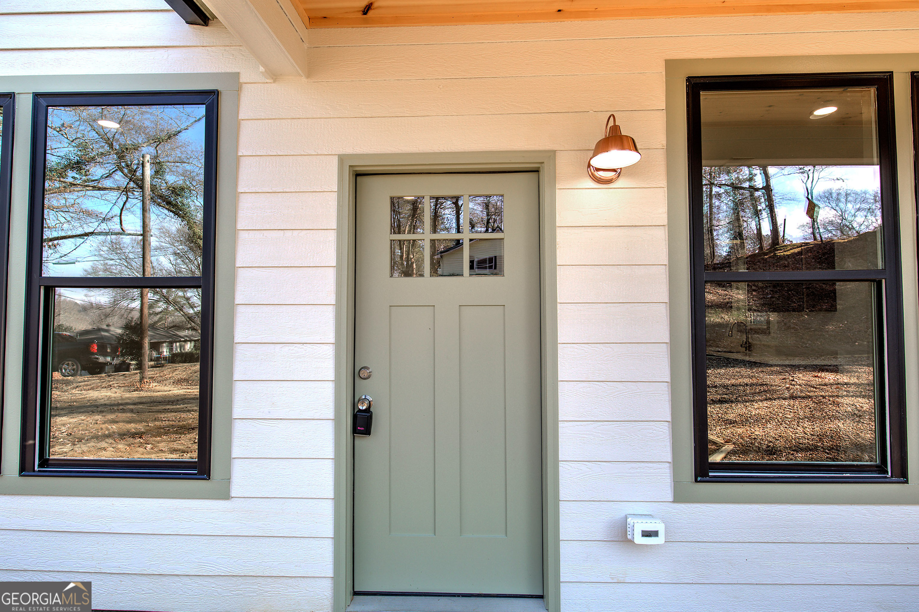 117 East Boundary Street Southeast Rome, GA 30161 - Photo 3 of 36 a front view of a house with a glass door and a window