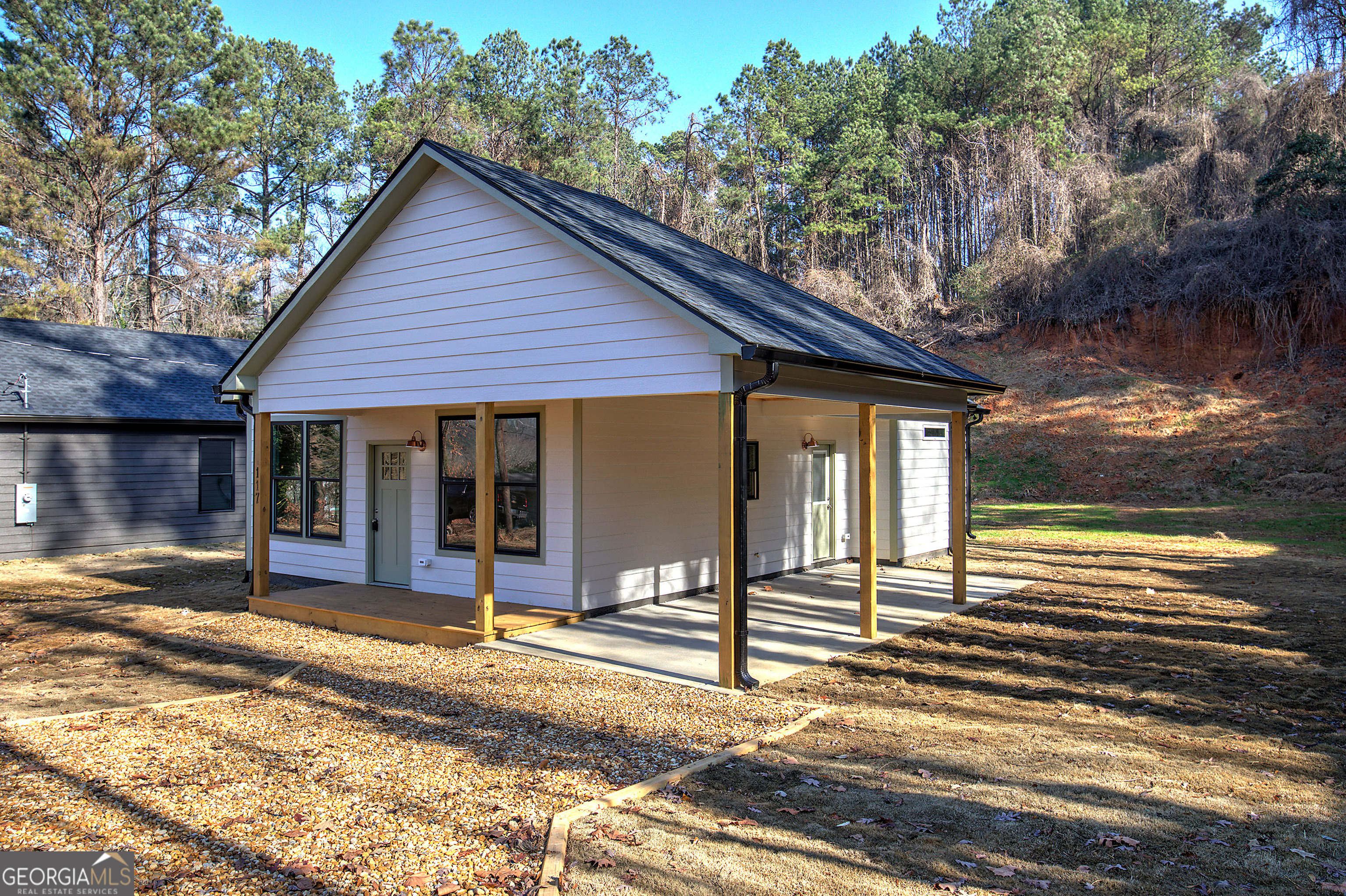 117 East Boundary Street Southeast Rome, GA 30161 - Photo 32 of 36 a view of a house with a patio and a yard
