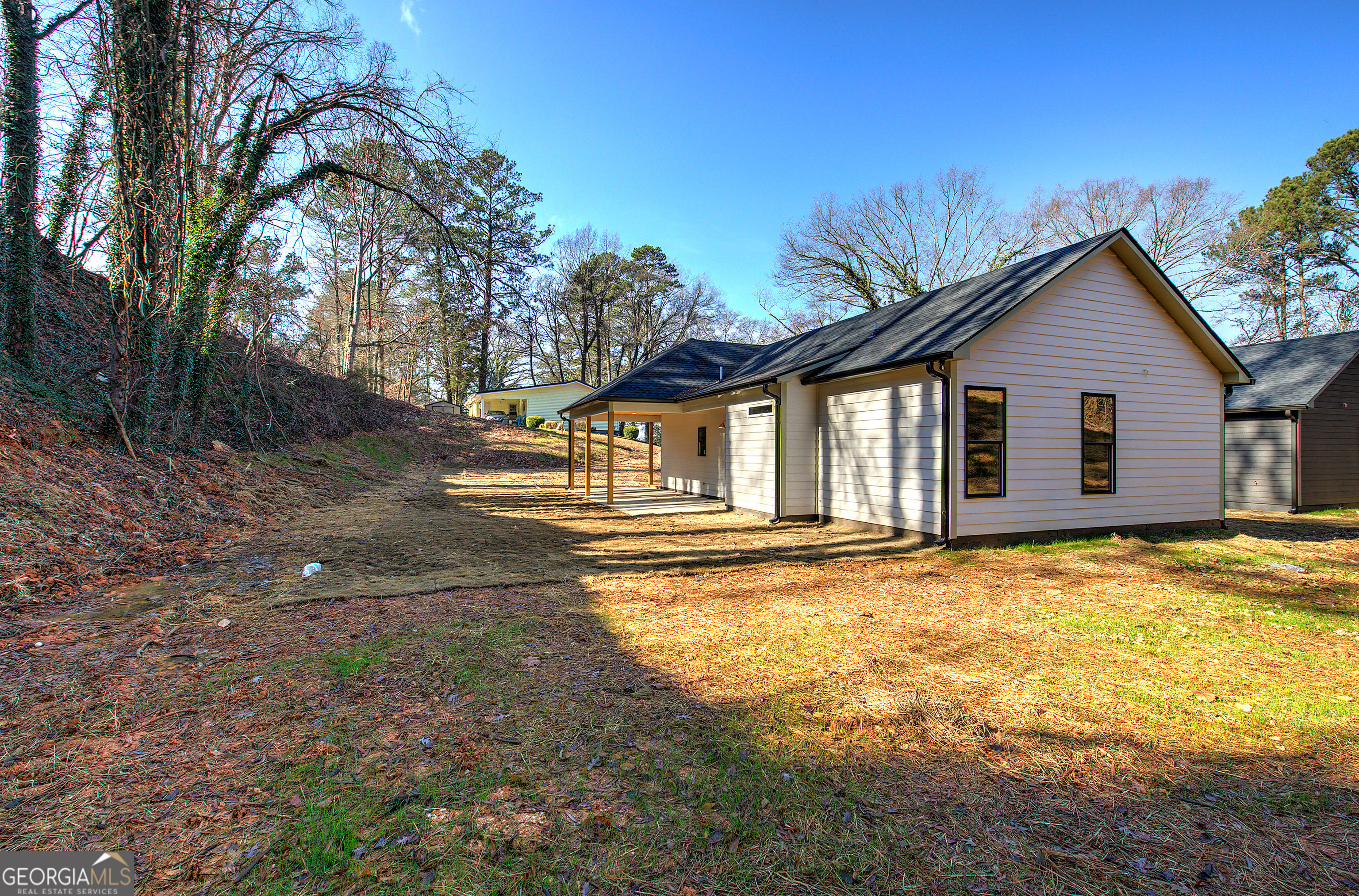 117 East Boundary Street Southeast Rome, GA 30161 - Photo 34 of 36 a view of a house with backyard and trees
