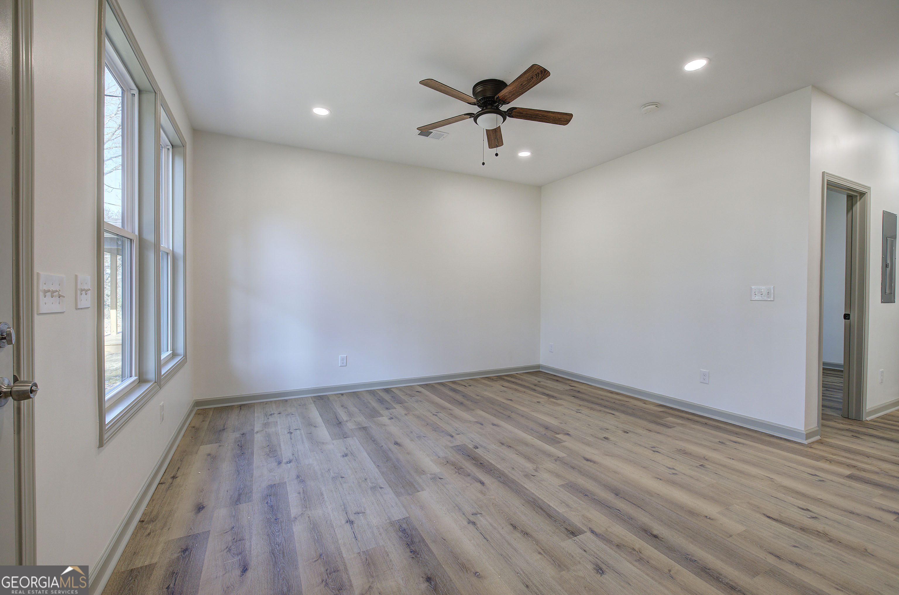 117 East Boundary Street Southeast Rome, GA 30161 - Photo 5 of 36 a view of empty room with wooden floor and fan