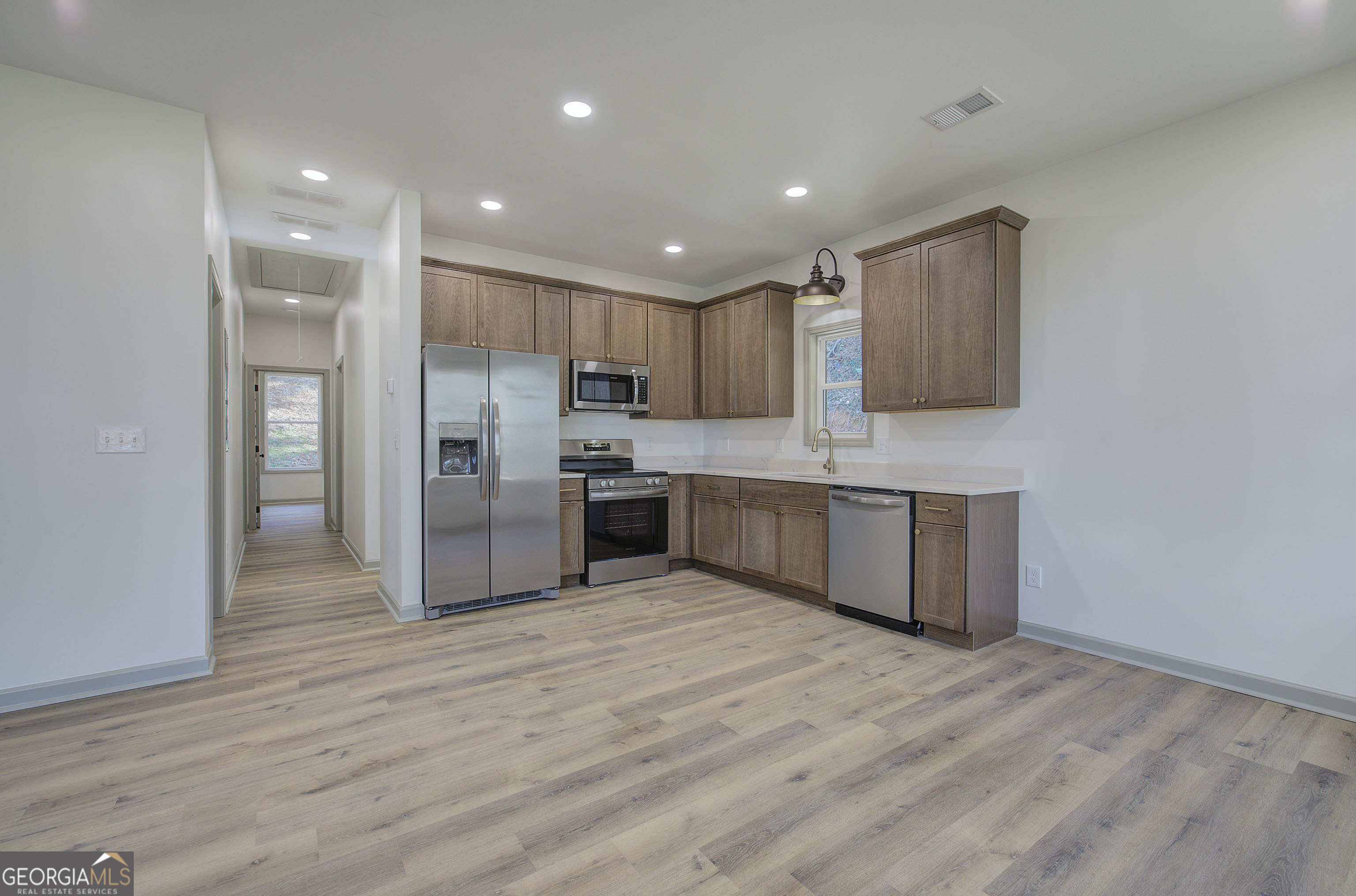 117 East Boundary Street Southeast Rome, GA 30161 - Photo 6 of 36 a large kitchen with stainless steel appliances granite countertop a large counter top a sink and a refrigerator