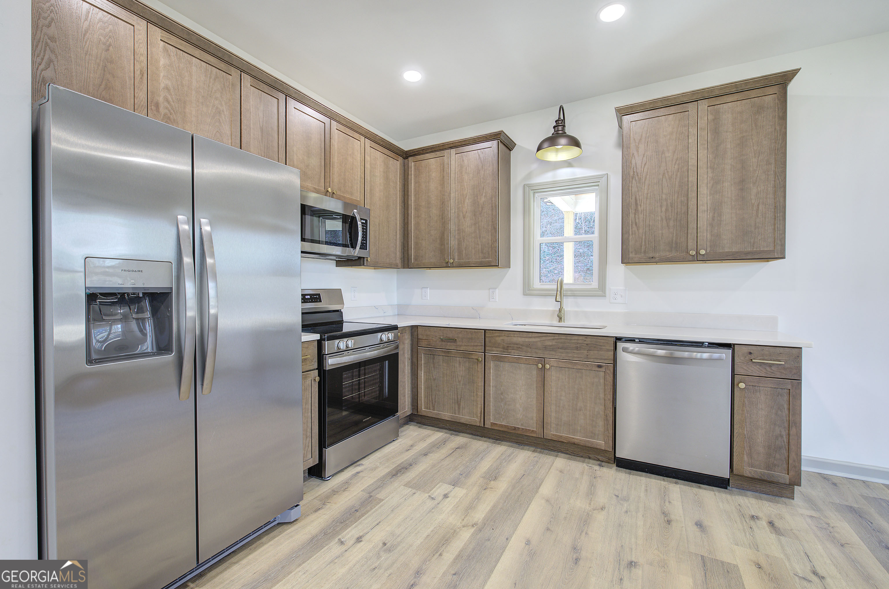 117 East Boundary Street Southeast Rome, GA 30161 - Photo 10 of 36 a kitchen with a refrigerator sink and microwave
