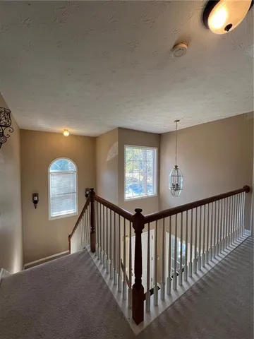 a view of a hallway with a workspace