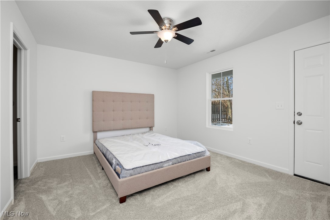 1999 East Oldgate Road Sandusky, OH 44870 - Photo 18 of 32 Carpeted bedroom featuring baseboards and ceiling fan