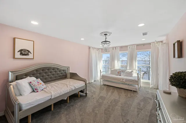 a bathroom with a toilet a sink a mirror a bathtub and shower